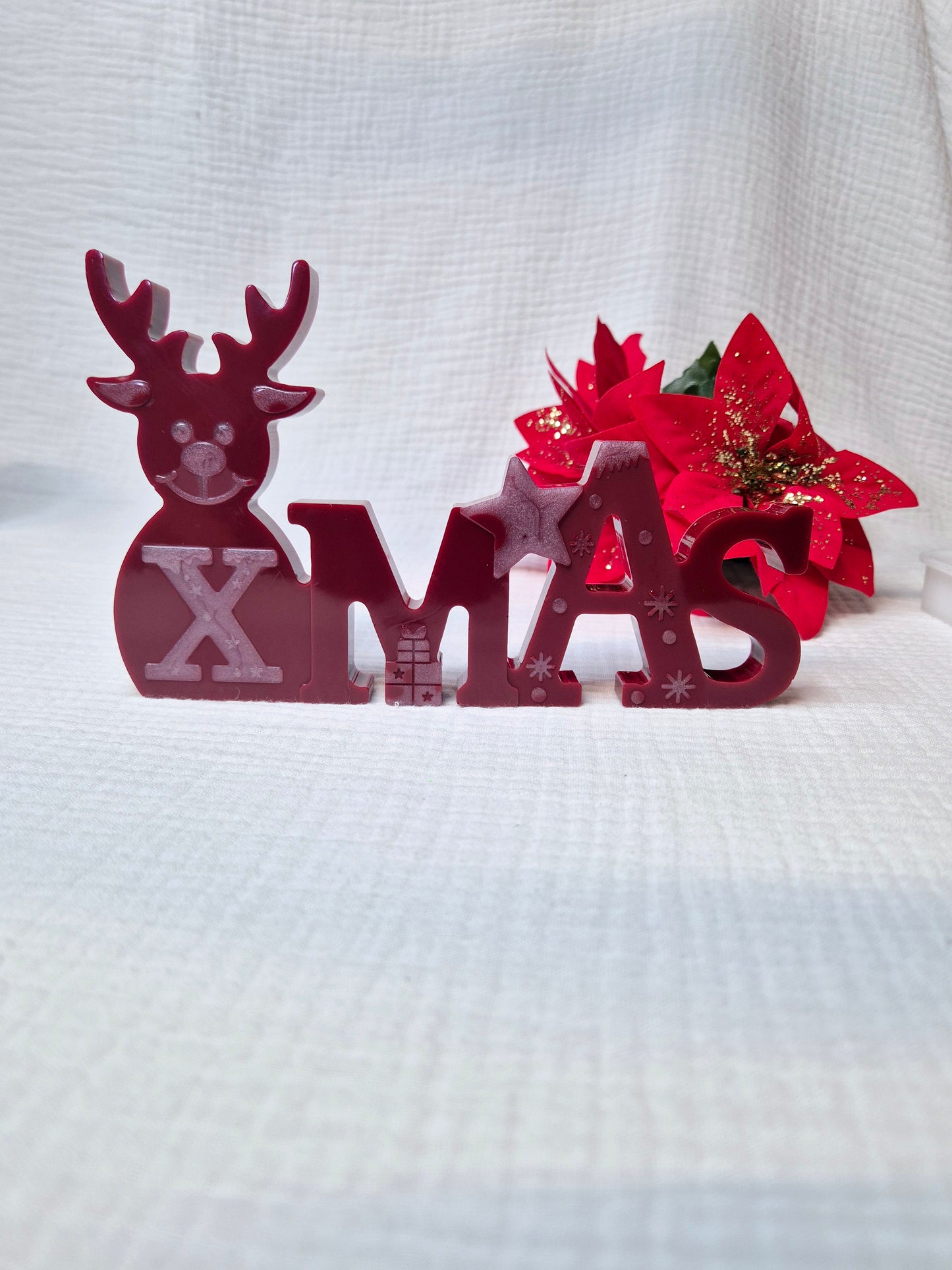 Schriftzug "Xmas" in verschiedenen Varianten