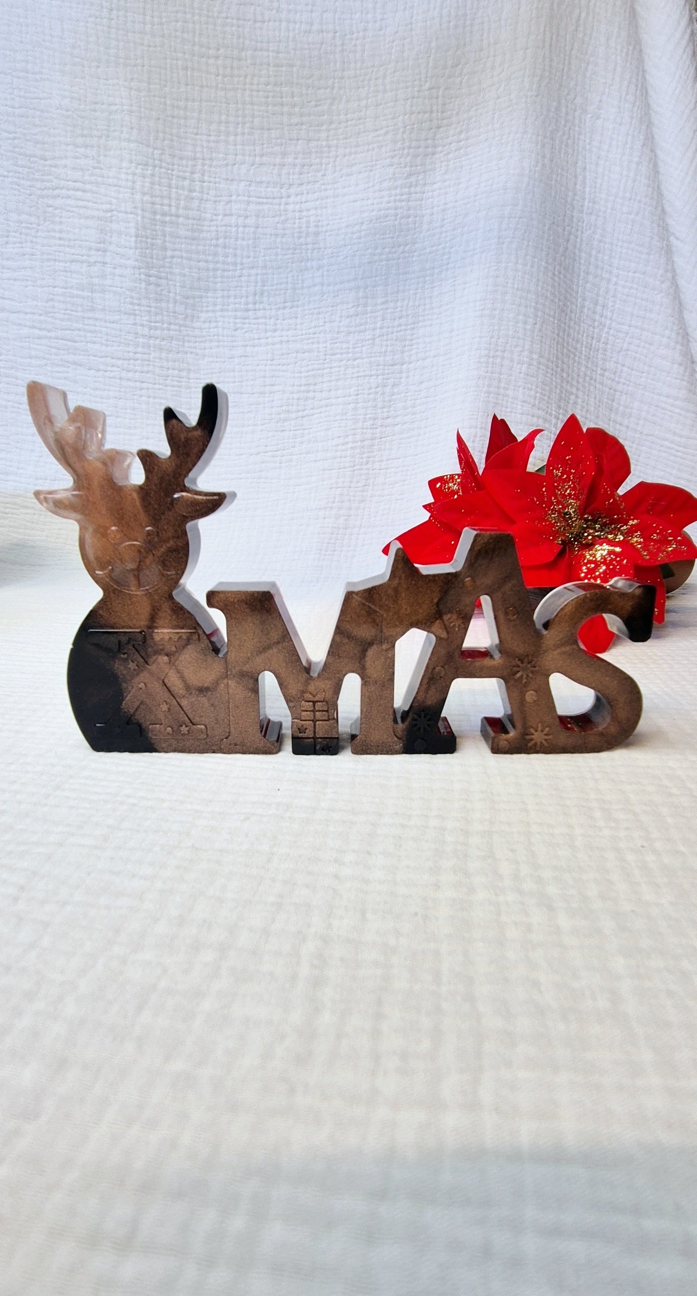 Schriftzug "Xmas" in verschiedenen Varianten