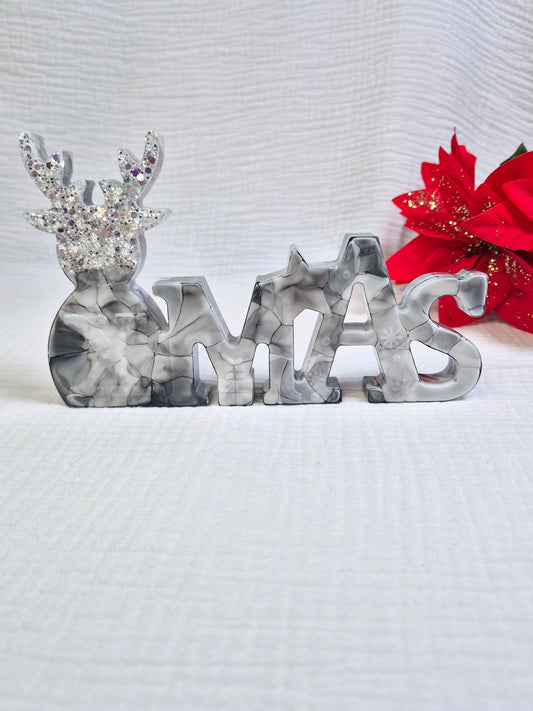 Schriftzug "Xmas" in verschiedenen Varianten