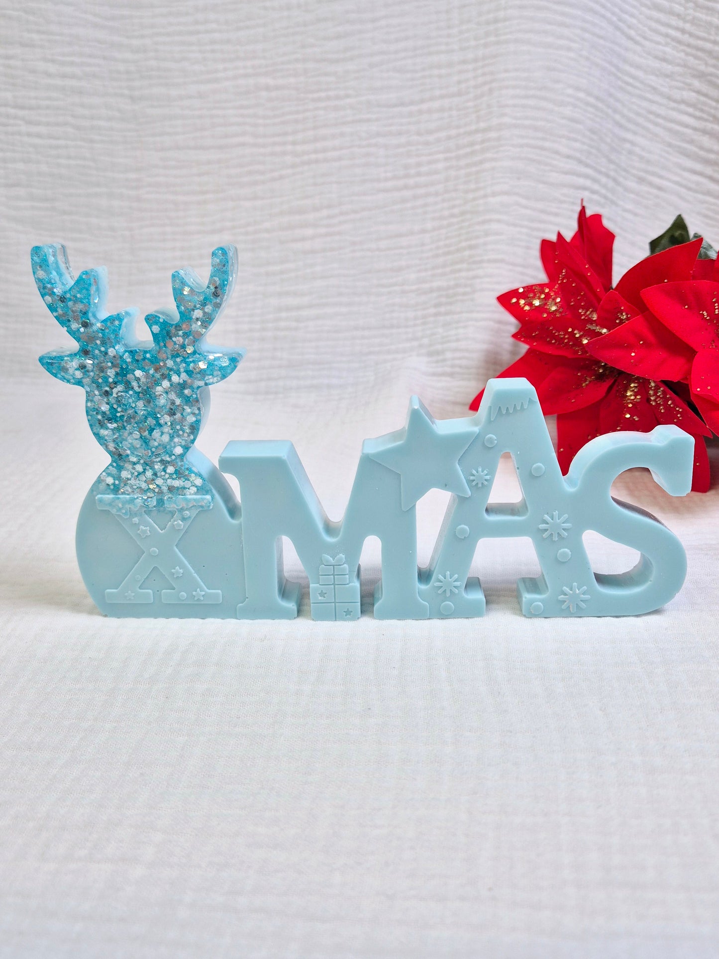 Schriftzug "Xmas" in verschiedenen Varianten