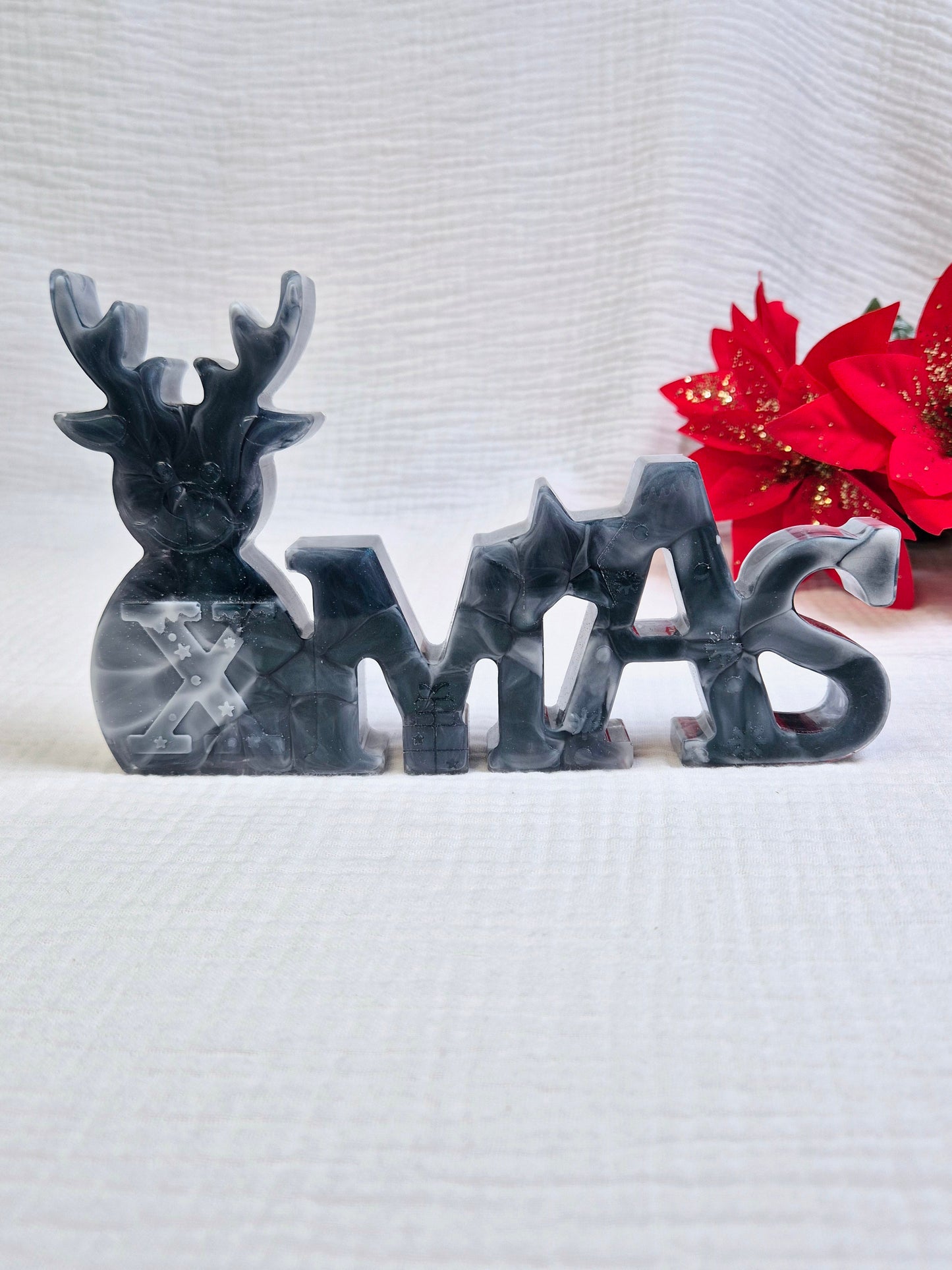 Schriftzug "Xmas" in verschiedenen Varianten
